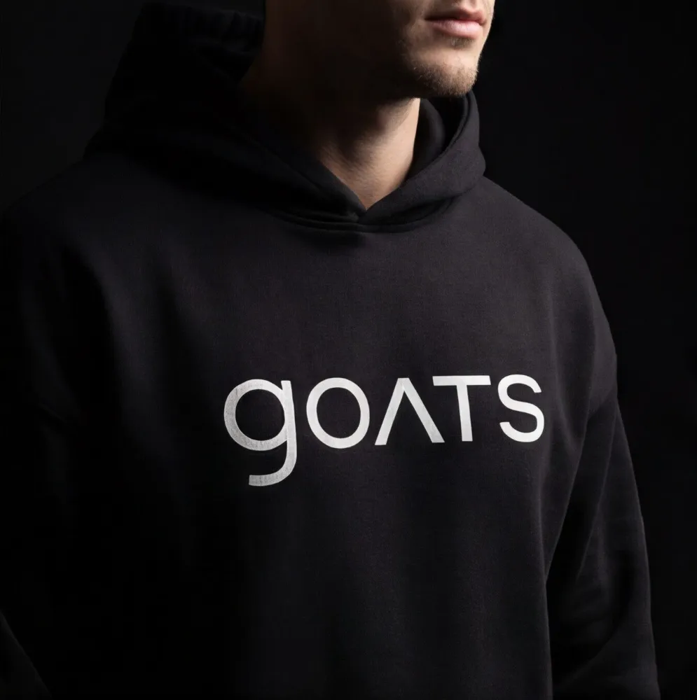 Black hoodie with a big GOATS print across the chest